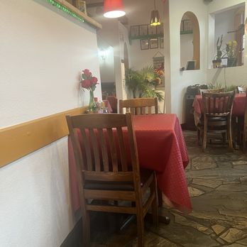 Hector's Casa - a table and chairs in a restaurant - Mexican Near Me - Kelowna, British Columbia
