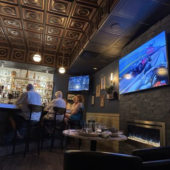83 Tavern - Interior bar area with 3 large TVs. - New American Near Me - Sarasota, Florida