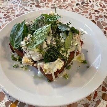 Agi's Counter - Ritzy-Titzy: poached chicken, buttermilk, valdeon cheese, Herbs on toasted potato bread - Hungarian Near Me - Brooklyn, New York