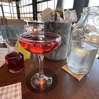Whiskey Cake Alliance - Prosecco with cranberry and pineapple juices - New American Near Me - Fort Worth, Texas Whiskey Cake Alliance - Prosecco with cranberry and pineapple juices - New American Near Me - Fort Worth, Texas