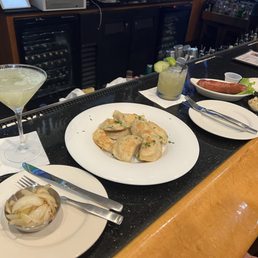 Pierogis, onions, kovbasa sausage, Ukrainian dirty martini, and Southern Cucumber drink are pictured here. Pierogis, onions, kovbasa sausage, Ukrainian dirty martini, and Southern Cucumber drink are pictured here.
