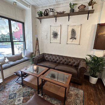 Enso Cafe - a living room with leather furniture - Coffee & Tea Near Me - Brooklyn, New York