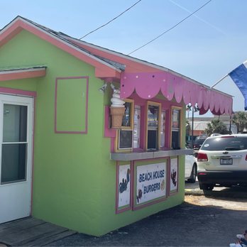 Beach House Burgers - a man riding a bike - Burgers Near Me - Kure Beach, North Carolina Beach House Burgers - a man riding a bike - Burgers Near Me - Kure Beach, North Carolina