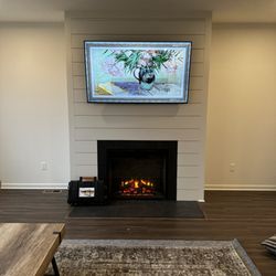 Tristate TV Mounting - LG Gallery TV installed over a custom, fireplace build-out.