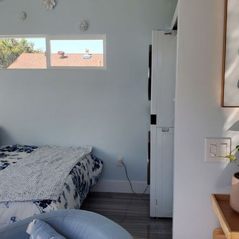 Black Dog West Construction - a bedroom with a bed and a couch - General Contractors Near Me - San Diego, California