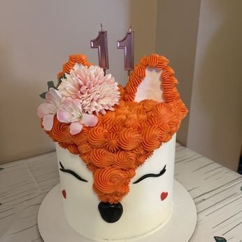 Sweet Heaven - a white cake with orange icing and flowers on top - Custom Cakes Near Me Sweet Heaven - a white cake with orange icing and flowers on top - Custom Cakes Near Me