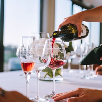 Chapelton Vineyards - wine being poured into wine glasses - Wineries Near Me - Washington, Texas Chapelton Vineyards - wine being poured into wine glasses - Wineries Near Me - Washington, Texas