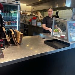 Chipotle Mexican Grill - Workers without hairnets, using profanity.