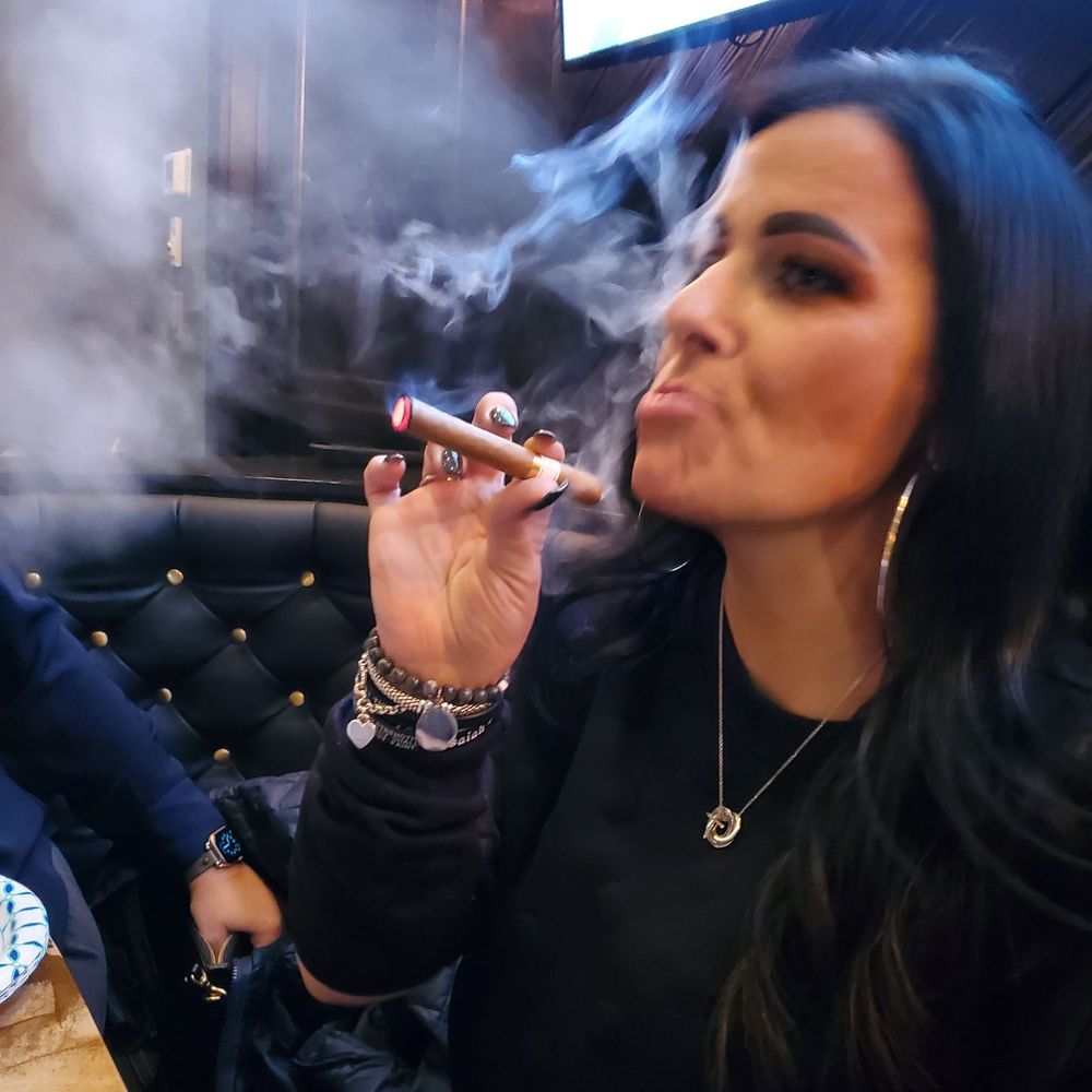 My beautiful wife having her first cigar gifted by the best host/owner Mike! Thank you! My beautiful wife having her first cigar gifted by the best host/owner Mike! Thank you!