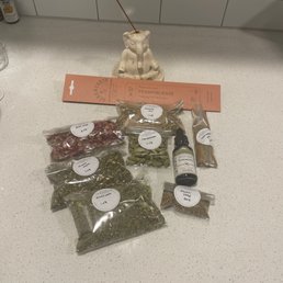 a variety of herbs on a counter a variety of herbs on a counter
