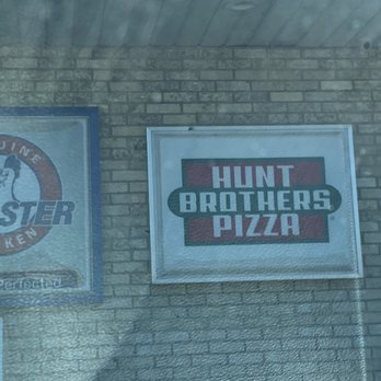 Hunt Brothers Pizza - two signs on a brick wall - Pizza Near Me - Lebanon Junction, Kentucky Hunt Brothers Pizza - two signs on a brick wall - Pizza Near Me - Lebanon Junction, Kentucky