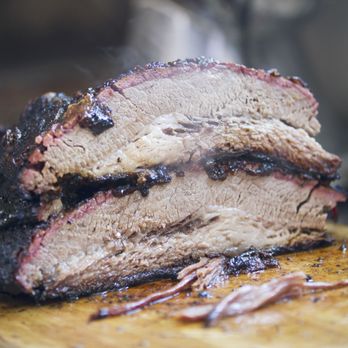 Frisco Smokehouse - a pork roast on a cutting board - Barbeque Near Me - Frisco, Texas Frisco Smokehouse - a pork roast on a cutting board - Barbeque Near Me - Frisco, Texas