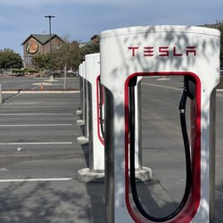 Tesla Supercharger - Manteca - Chargers with Bass Pro Shop in the distance