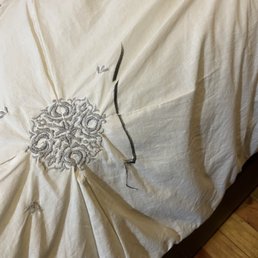 White bedspread with black Sharpie. No response from AAA for replacement. White bedspread with black Sharpie. No response from AAA for replacement.
