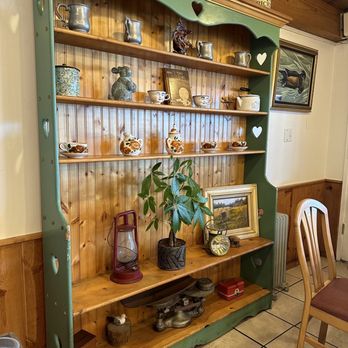 Redwood Cafe - a shelf with a potted plant on it - New American Near Me - Cambria, California Redwood Cafe - a shelf with a potted plant on it - New American Near Me - Cambria, California