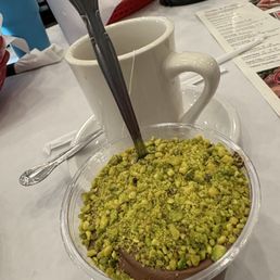 Chocolate pudding with pistachio topping