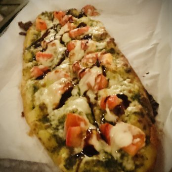 Wild Rover Brewing Company - Lovely Rita Flatbread. EVOO, mozzarella, tomato, pesto and fresh basil. - Pubs Near Me - Tampa, Florida Wild Rover Brewing Company - Lovely Rita Flatbread. EVOO, mozzarella, tomato, pesto and fresh basil. - Pubs Near Me - Tampa, Florida