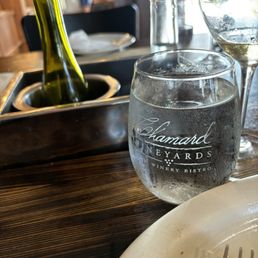 These sunken bottle holders are thoughtful. If you are sitting across from guests you can see them.