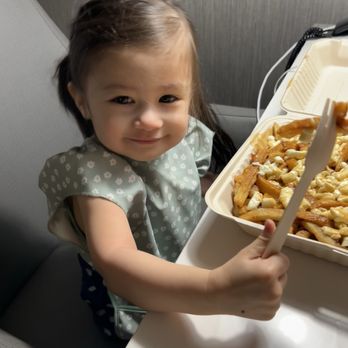 La Banquise - Our daughter's first poutine - Poutineries Near Me - Montreal, Quebec