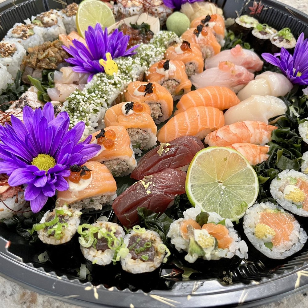 Sushi Fella - a plate of sushi with purple flowers - Sushi Bars Near Me - Lake Worth, Florida Sushi Fella - a plate of sushi with purple flowers - Sushi Bars Near Me - Lake Worth, Florida