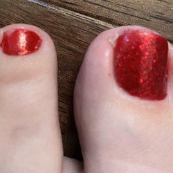 V Nails - Pedicure. Polish rubbed of by tech. Polish all over cuticles.