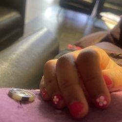 Lovely Nails 2 - Manicure with nail art on child.