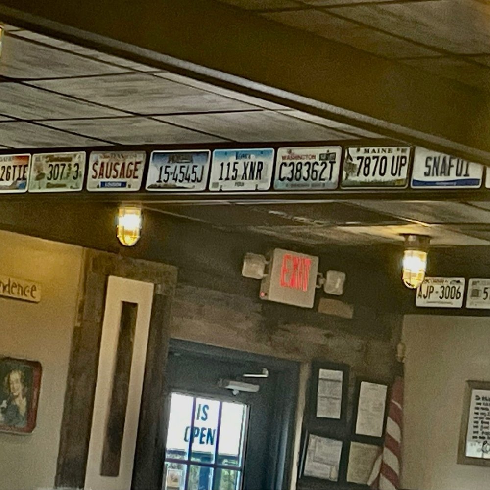 The Burgers - License plates from various states line up along the beams in the ceiling - Burgers Near Me - Lenoir City, Tennessee