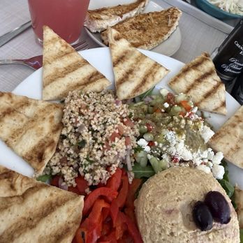 Blu Island Bistro - Mediterranean Platter with grilled mahi mahi. Homemade hummus, cucumber salad, tabouli, red peppers and warm pita. - New American Near Me - Venice, Florida Blu Island Bistro - Mediterranean Platter with grilled mahi mahi. Homemade hummus, cucumber salad, tabouli, red peppers and warm pita. - New American Near Me - Venice, Florida
