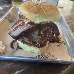 Smoke Stack Sandwich (chopped bbq/ cheddar jalapeño sausage/brisket topped with pimento cheese and drizzle with bbq sauce