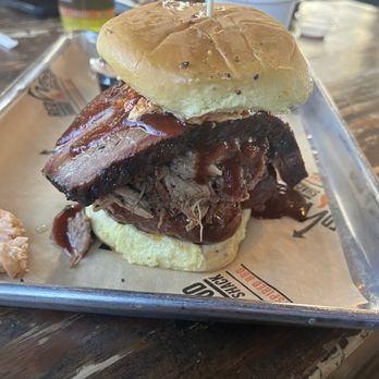 Redwood Smoke Shack - Smoke Stack Sandwich (chopped bbq/ cheddar jalapeño sausage/brisket topped with pimento cheese and drizzle with bbq sauce - Barbeque Near Me - Norfolk, Virginia