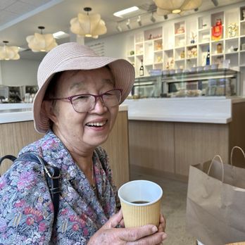 Mille Fete - My aunt enjoying a hot cup of coffee and cookies! - Bakeries Near Me - Honolulu, Hawaii Mille Fete - My aunt enjoying a hot cup of coffee and cookies! - Bakeries Near Me - Honolulu, Hawaii
