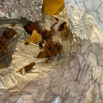 DAS BBQ - a piece of food wrapped in tin foil - Barbeque Near Me - Atlanta, Georgia