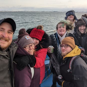 Shelby's Travel Guide - Group shot, whale watching, Iceland - Travel Agents Near Me