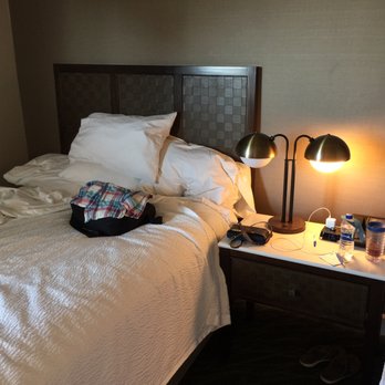 The Dextro - Our cramped space with two Queen beds and little room to move around. Nightstand and lamp with few convenient power options. - Hotels Near Me - San Diego, California The Dextro - Our cramped space with two Queen beds and little room to move around. Nightstand and lamp with few convenient power options. - Hotels Near Me - San Diego, California