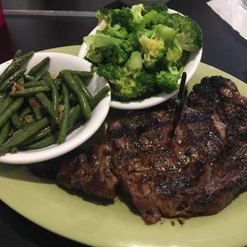 Rick's Crossroads Grille - 14 oz Ribeye hand cut with green beans and steamed broccoli. - Steakhouses Near Me - Lincoln, Alabama
