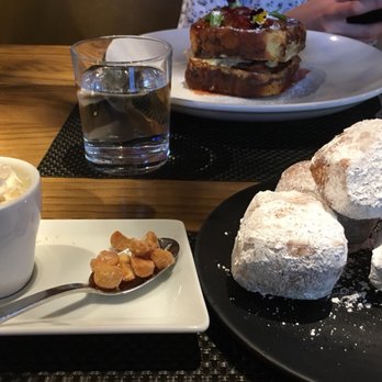 Sabio on Main - Beignets (w/whipped cream on top of a coffee choc sauce & candied mac nuts) [Pictured behind: Monte Cristo "style" Sandwich - not fried] - New American Near Me - Pleasanton, California