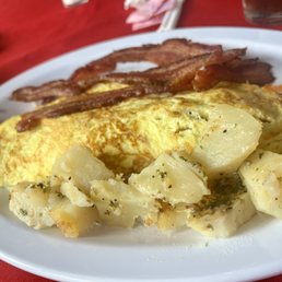 an omelet with potatoes and bacon an omelet with potatoes and bacon