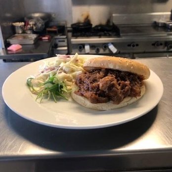Cav-OK Grill - a pulled pork sandwich on a plate - Asian Fusion Near Me - Calgary, Alberta Cav-OK Grill - a pulled pork sandwich on a plate - Asian Fusion Near Me - Calgary, Alberta