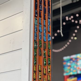 The Hangout - a close up of a wall with a bunch of stickers on it - Burgers Near Me - Myrtle Beach, South Carolina
