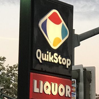 Quik Stop - a sign for a liquor store - Gas Stations Near Me - Antioch, California