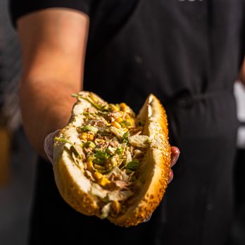 Pilot Subs - a person holding a hot dog - Fast Food Near Me - Toronto, Ontario Pilot Subs - a person holding a hot dog - Fast Food Near Me - Toronto, Ontario