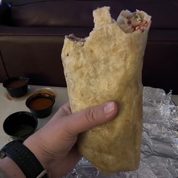 Taqueria De La Rosas - Sonoran burrito with crema. - Tacos Near Me - Jacksonville, North Carolina Taqueria De La Rosas - Sonoran burrito with crema. - Tacos Near Me - Jacksonville, North Carolina