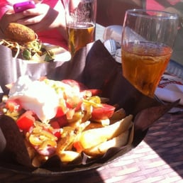 Sticky Fingers - Wedges, Polish sausage, jalapeños, avocado and sour cream. On the patio.