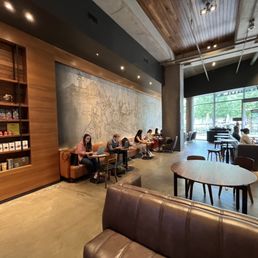people sitting at tables in a coffee shop people sitting at tables in a coffee shop