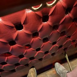 Tin Lizzie Saloon - The old school red leather knee bump wall, nostalgic.