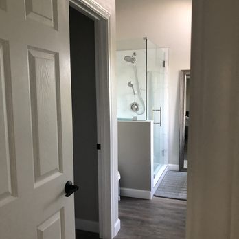 Nik Construction & Remodeling - Master bathroom reconfigured and walk in closet expanded - General Contractors Near Me
