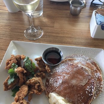 Trust - Fried chicken and pancakes!  Fried chicken was crispy, flavorful and well-seasoned.  Matched it with a bottle of champagne. - New American Near Me - San Diego, California