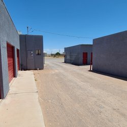 Mohave Storage - Topock - Roll-up door unit behind secure fencing and combo lock gate, Drive-up access.