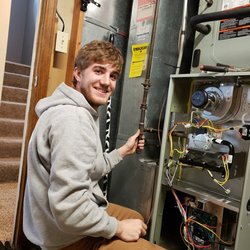 Double C Heating & Air Conditioning - Hard at work on a repair