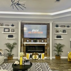 Custom Furniture and Cabinets - Floating shelves with custom built wall paneling